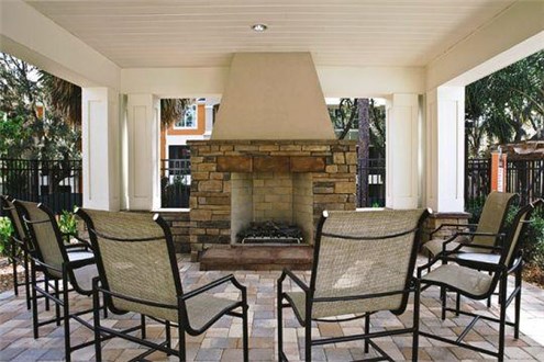 Covered Fireplace Area by Pool